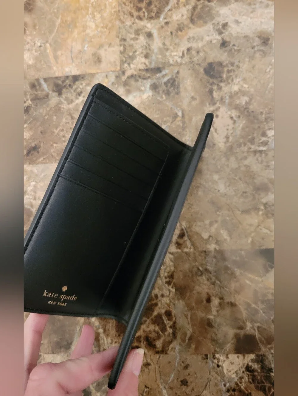 kate spade black saffiano passport wallet with gold logo